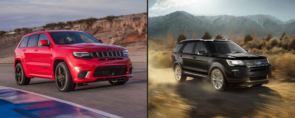 A red 2018 Jeep Cherokee next to a black 2018 Ford Explorer