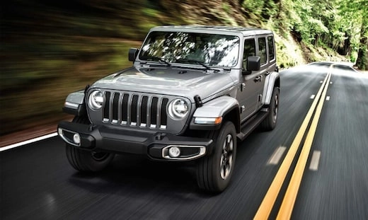 2019 Silver Jeep Wrangler Driving on a Highway