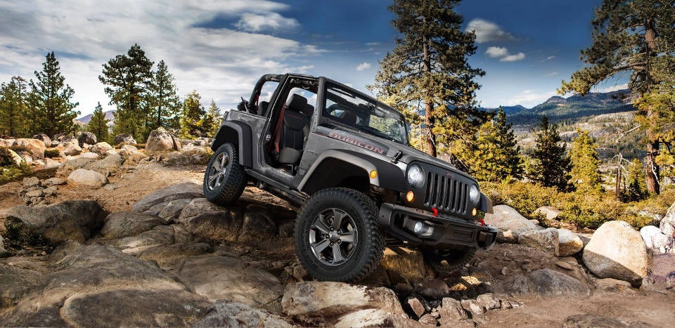 A 2018 Jeep Wrangler JK parked over rocks 